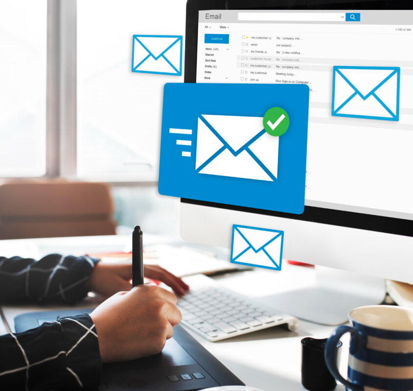 Person using email with an email icon visible.