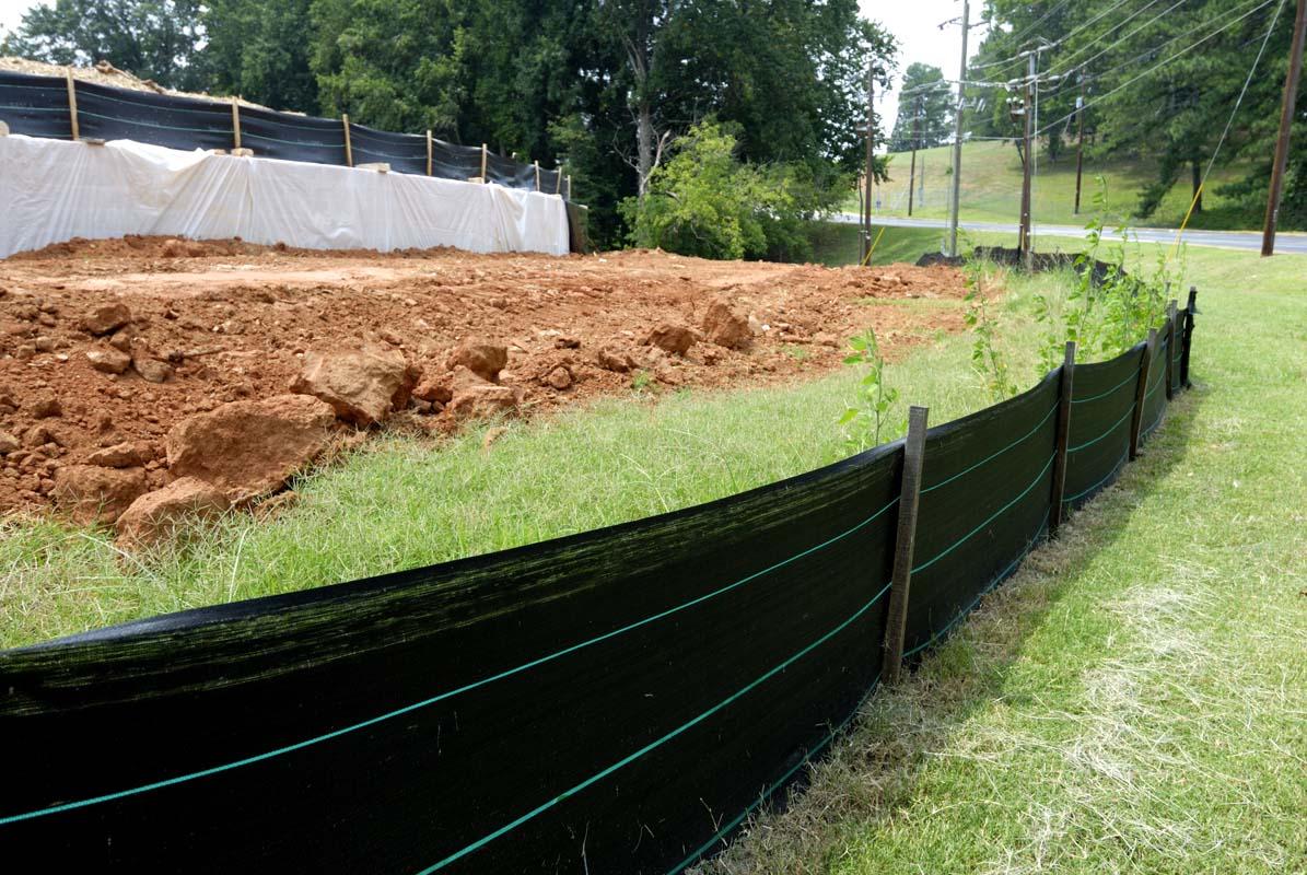 Photo of a silt fence for erosion control, illustrating sediment and erosion management in environmental conservation.