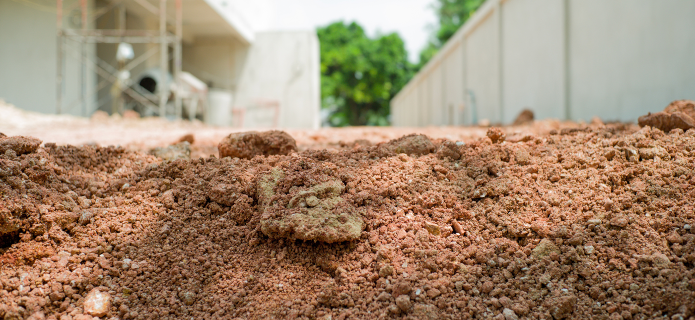 Photo of excavated dirt in a construction yard, showcasing earthmoving and construction activities.